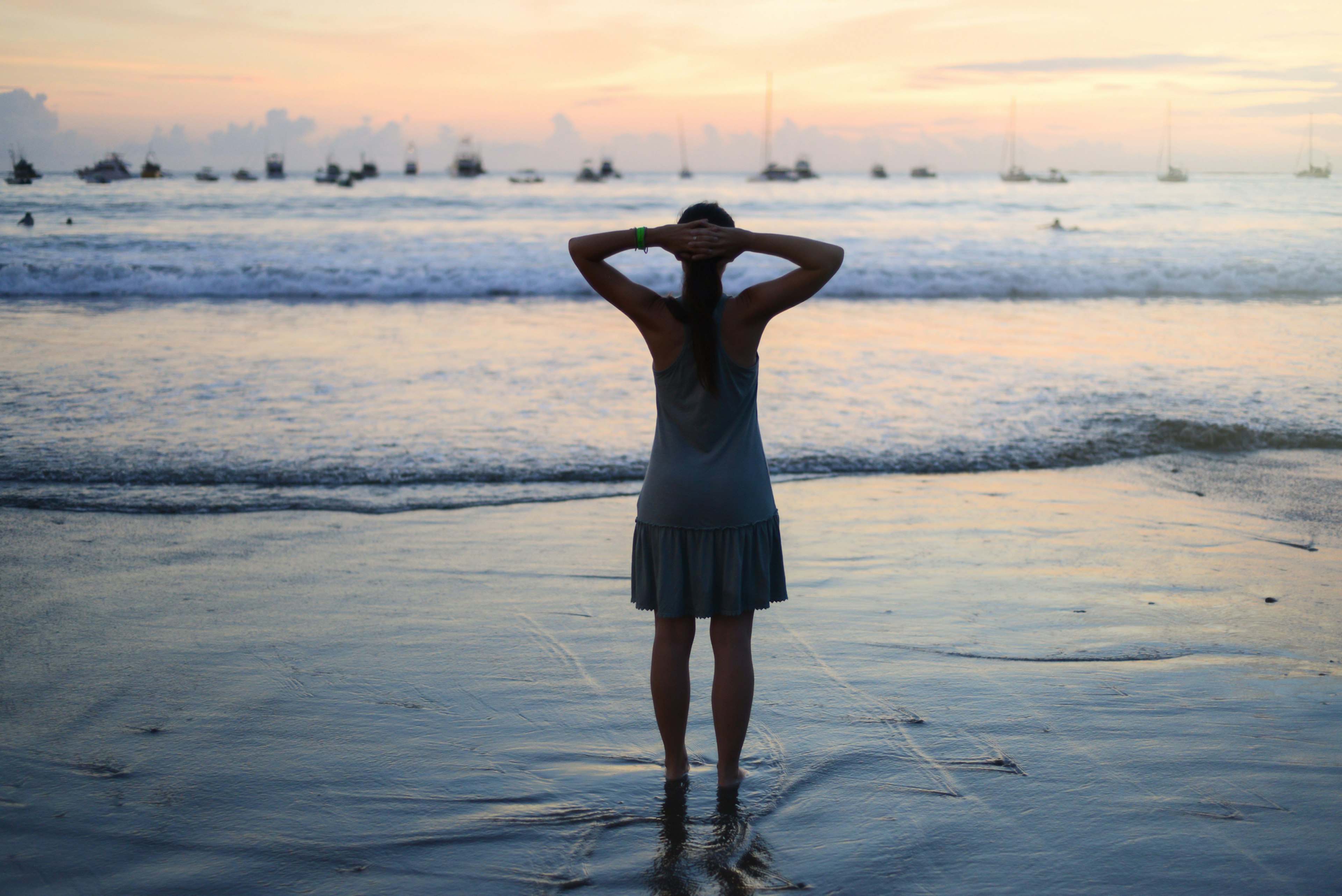 Woman wearing dress on the beach with hands up supporting the head.The woman has her feet in the water during sunset in San Juan del Sur, Nicaragua.
555761647
Woman wearing dress on the beach with hands up supporting the head.The woman has her feet in the water during sunset in San Juan del Sur, Nicaragua.